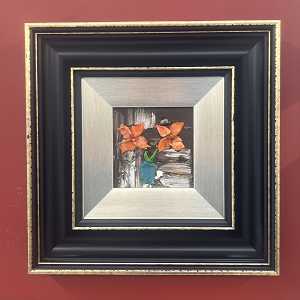 Orange flowers in teal vase